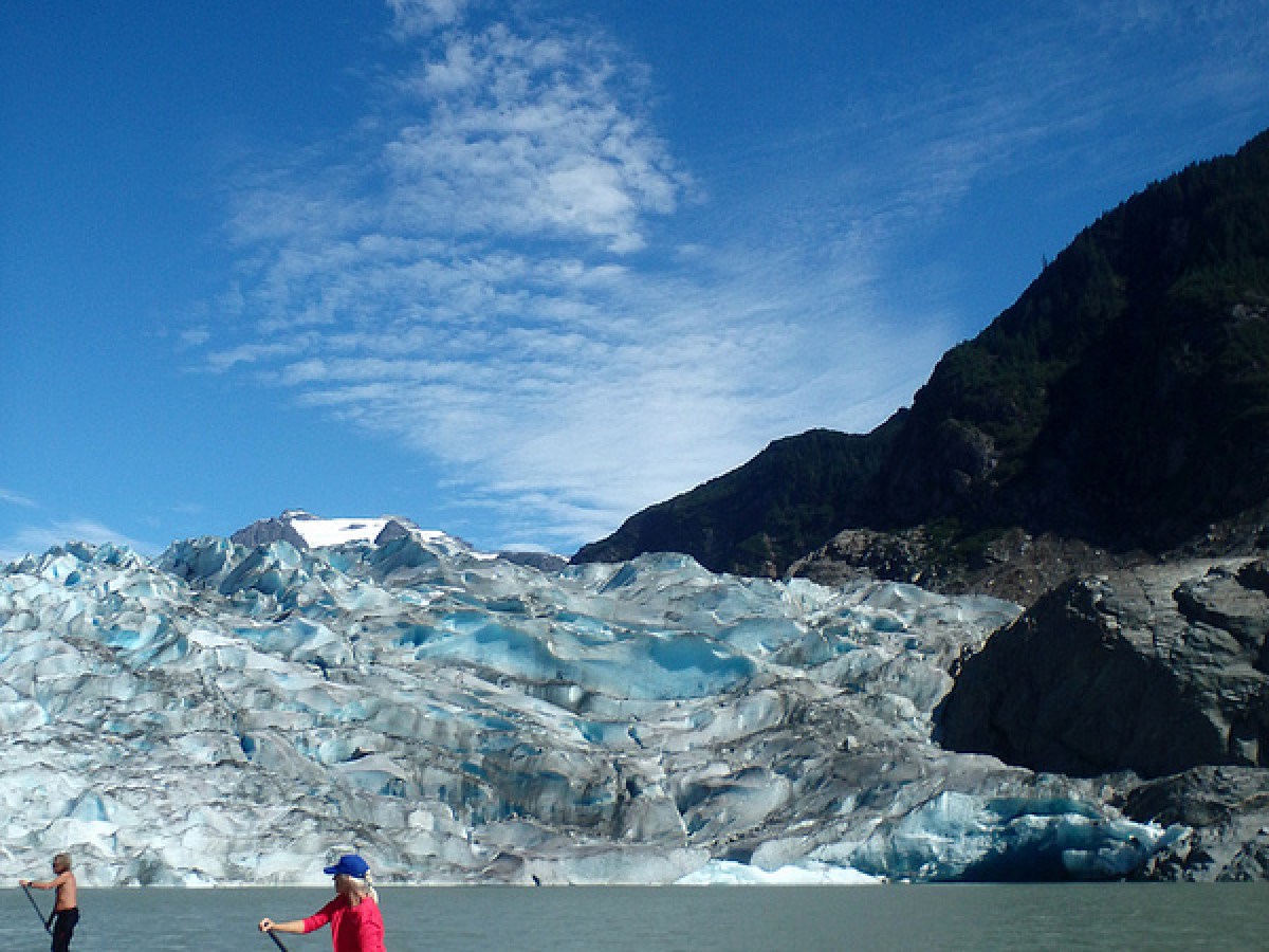 a group of people riding skis on a body of water