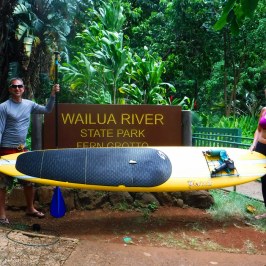 a person sitting on a bench in a park