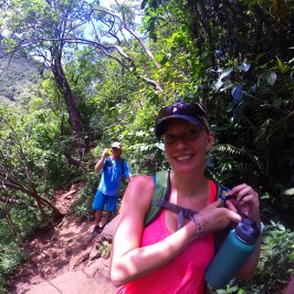 a woman standing in a garden