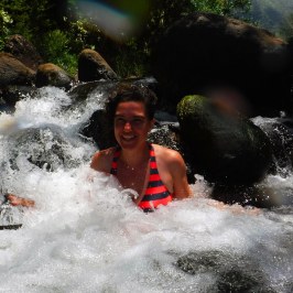 a man riding a wave on a surfboard in the water
