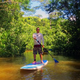 a man riding a surfboard in the water