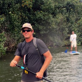 a man riding on the back of a boat