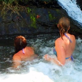 a child swimming in a pool of water
