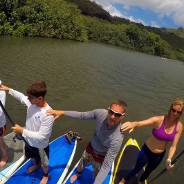 a group of people that are standing in the water