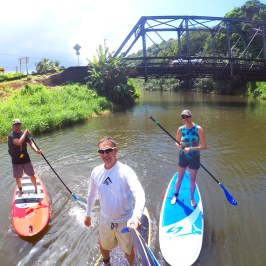 a group of people in a boat on a body of water