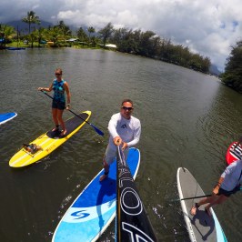 a group of people in a boat on a body of water