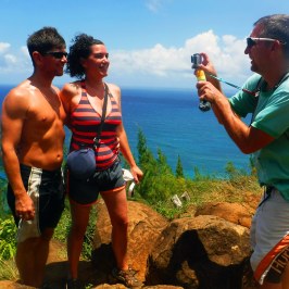 a couple of people that are standing in the water