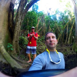 a person standing in front of a tree posing for the camera