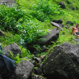a man sitting on a rock