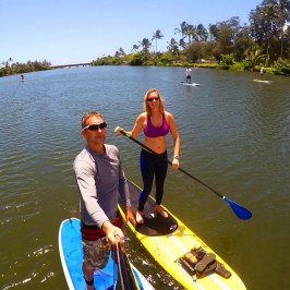a group of people in a boat on a body of water