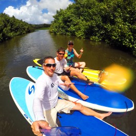 a person standing next to a body of water