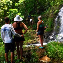 a group of people standing on a rock