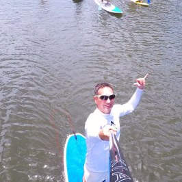a person standing next to a body of water