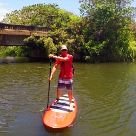 a man rowing a boat in the water