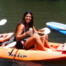 a group of people riding on the back of a boat