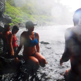 a group of people that are standing in the water
