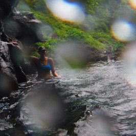 a person standing next to a body of water