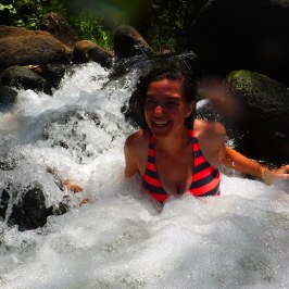 a man riding a wave on top of a body of water