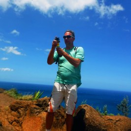 a person standing on a rocky hill