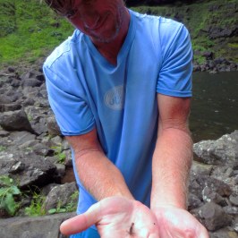 a man sitting on a rock