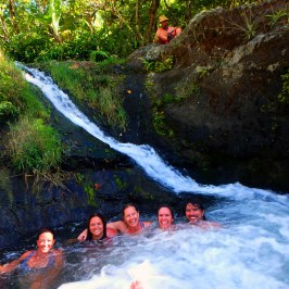 Sheryl Sandberg et al. in a pool of water