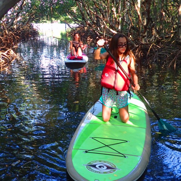 a person standing in front of a lake