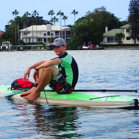 a man rowing a boat in the water