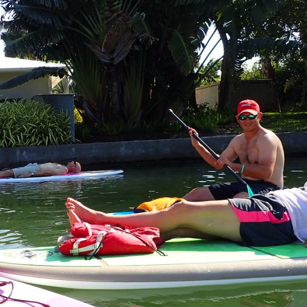 a group of people riding on the back of a boat