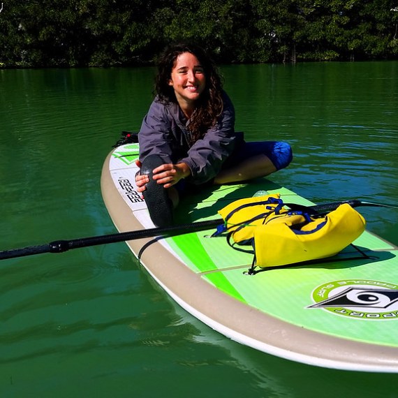 Claire Shorall in a green boat on a body of water