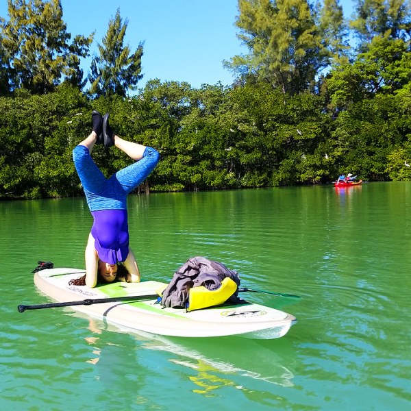 a person riding on the back of a boat in the water