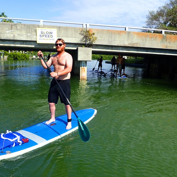 a person riding a surf board on a body of water