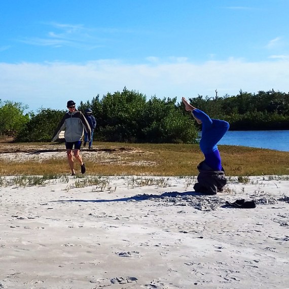 a person standing on a beach near a body of water