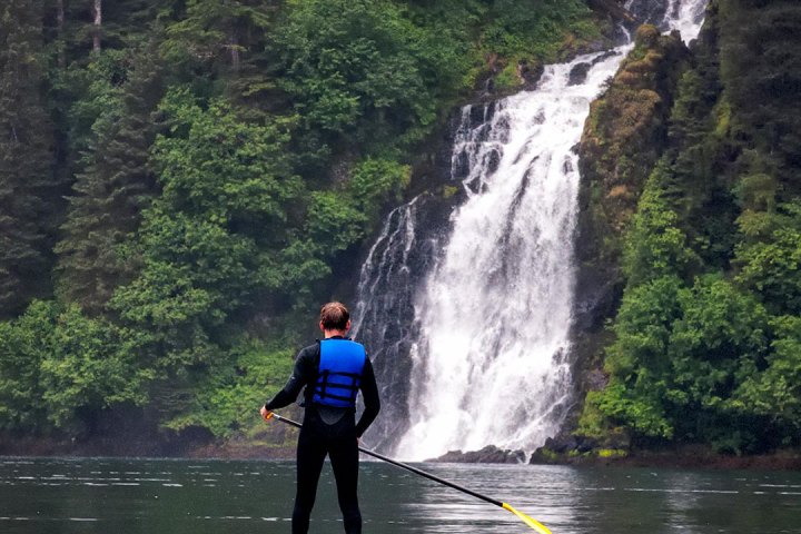 a man riding skis down a river