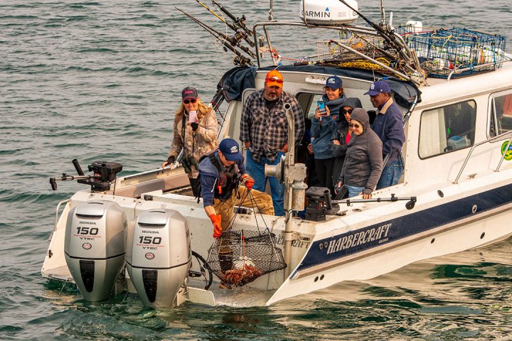 a group of people on a boat in the water